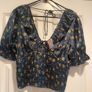 Beautiful Free People Blouse. Never worn. V-neckline in the front and back, M